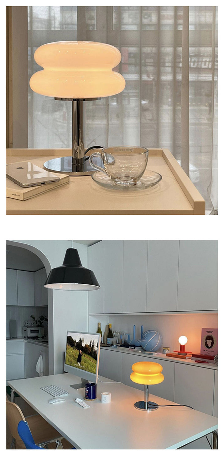 Stylish glass table lamp with LED for reading in a bedroom or study space.