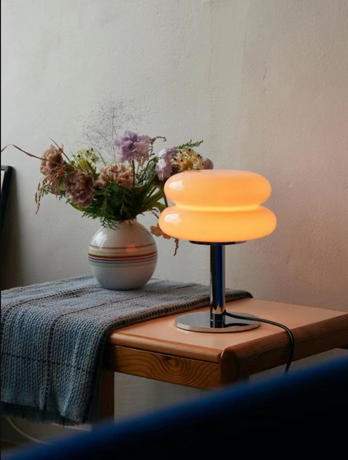 Elegant LED table lamp made of glass, ideal for creating a cozy bedroom atmosphere.