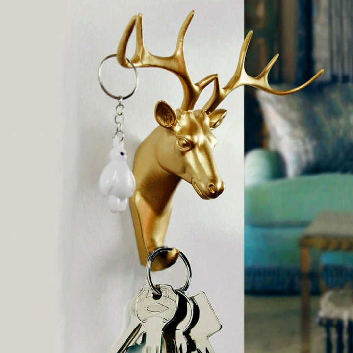 Golden stag head wall hook. Chic animal decor & functional hanger for coats, bags, towels.