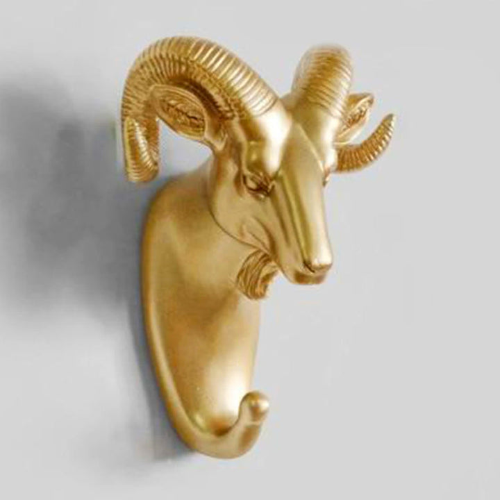 Set of gold animal wall hooks. Decorative & practical storage solution for coats, towels, accessories.