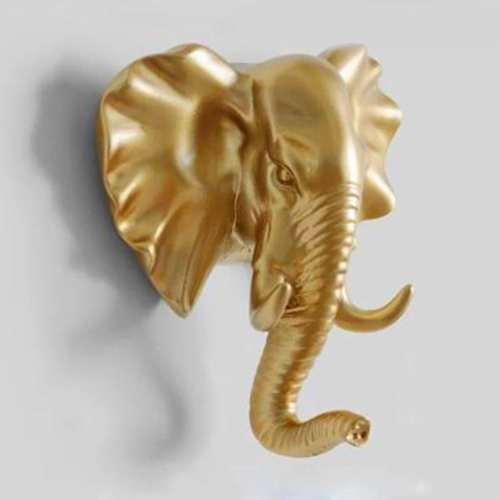Decorative gold lion head wall hook. Bold animal wall decor & functional coat hanger for home.