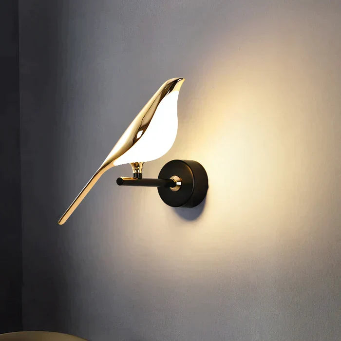 Elegant gold bird LED wall lamp illuminating a modern living room. Perfect accent lighting & home decor.