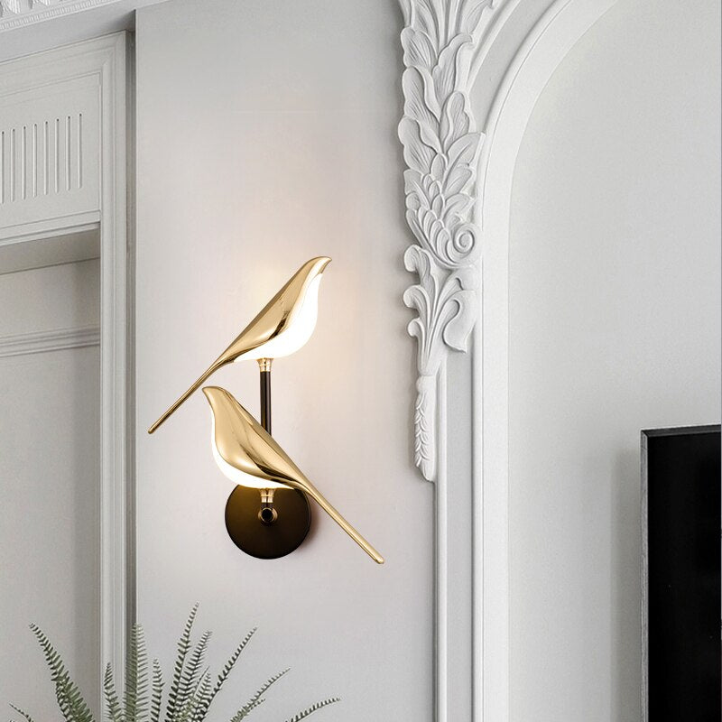 Unique bird LED wall lamp, a decorative gold fixture for modern home decor, providing warm indoor lighting.