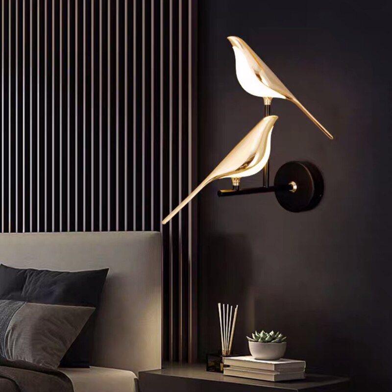 Decorative LED bird wall lamp in gold finish, offering elegant, contemporary lighting for any living space.