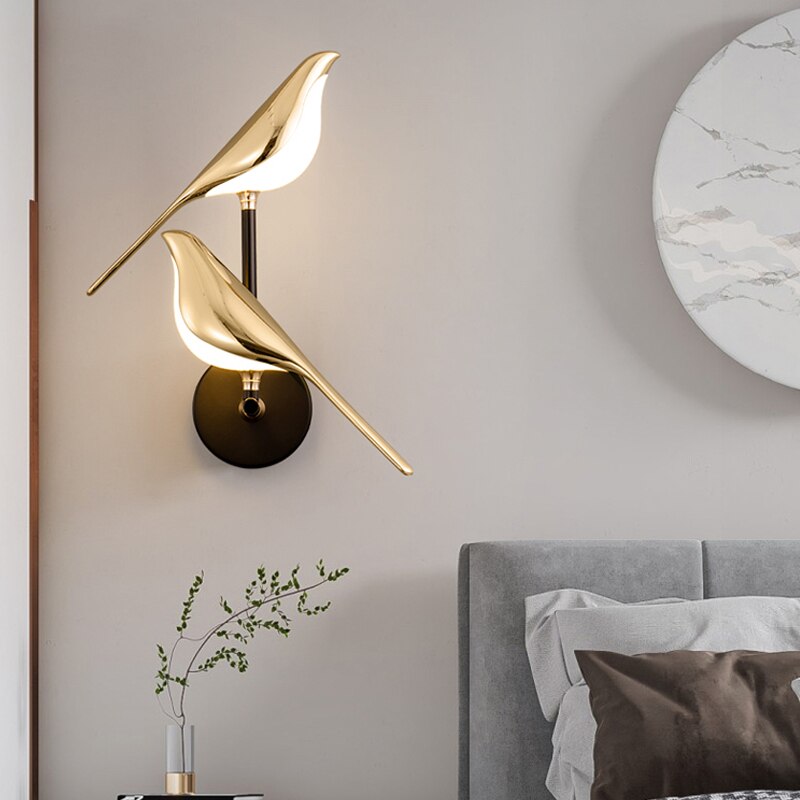 Stylish gold bird wall light, an LED modern lighting solution & unique home decor piece for your walls.