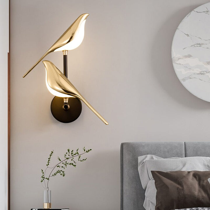 Stylish gold bird wall light, an LED modern lighting solution & unique home decor piece for your walls.