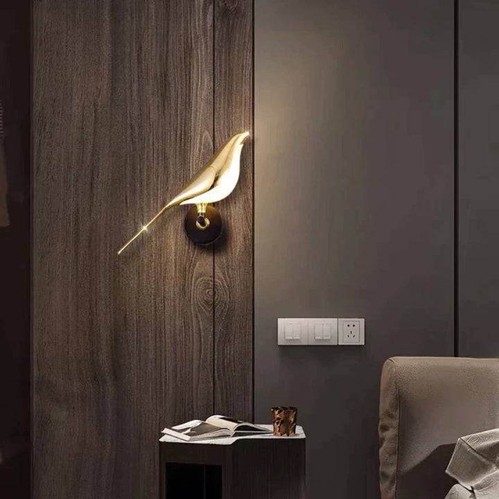 Contemporary gold bird LED wall sconce, elegant indoor lighting and a decorative accent for modern homes.