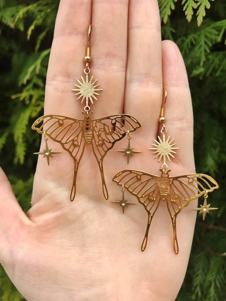 Elegant gold butterfly & moth drop earrings for women, featuring a delicate nature-inspired design. Fashion jewelry.