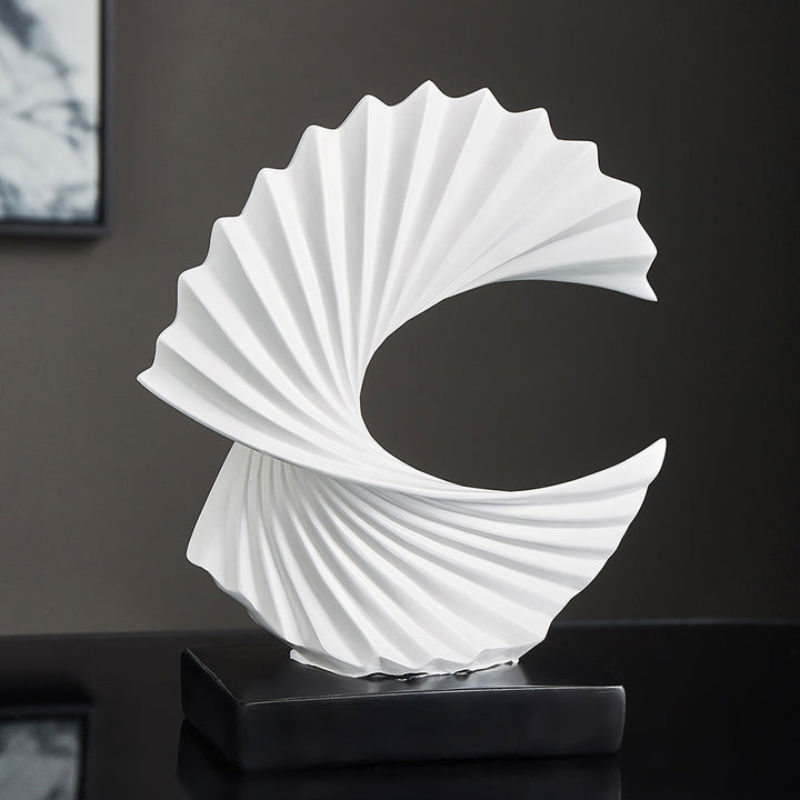 Modern art crescent moon statue, elegant home decor piece for celestial or abstract themed interiors.