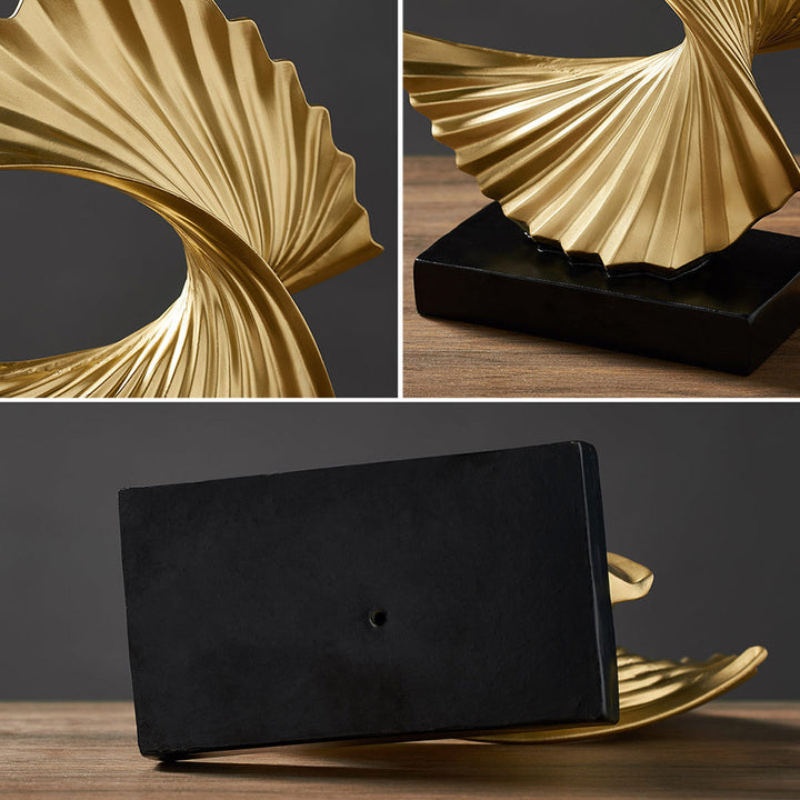 Stylish crescent moon sculpture, elegant celestial home decor in a gold & white resin finish.