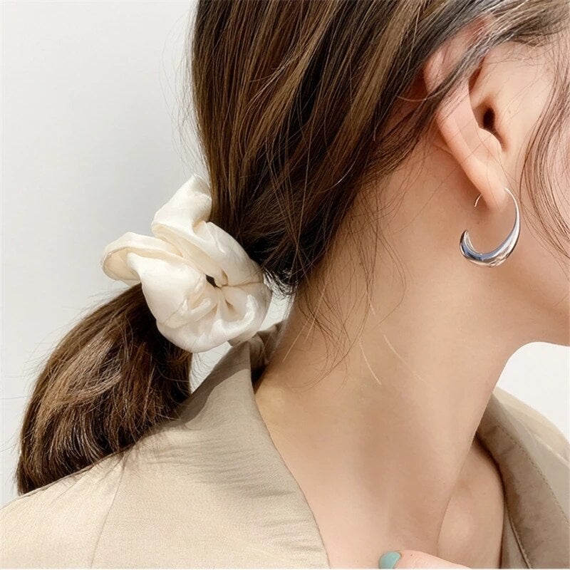 Women's elegant gold & silver dangle earrings. Luxurious jewelry, a timeless fashion accessory, perfect for her.