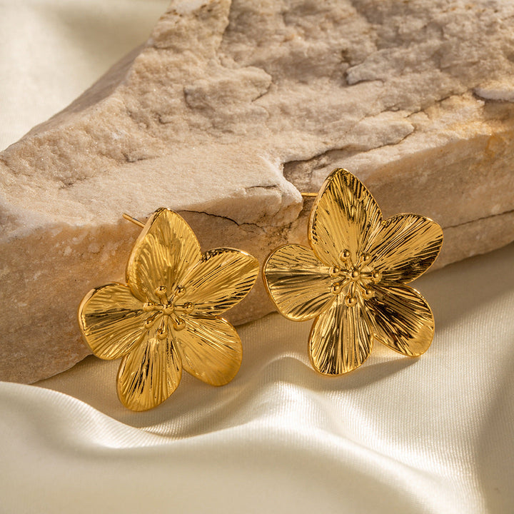 Close-up of Elara gold floral earrings, intricate design, hypoallergenic women's jewelry