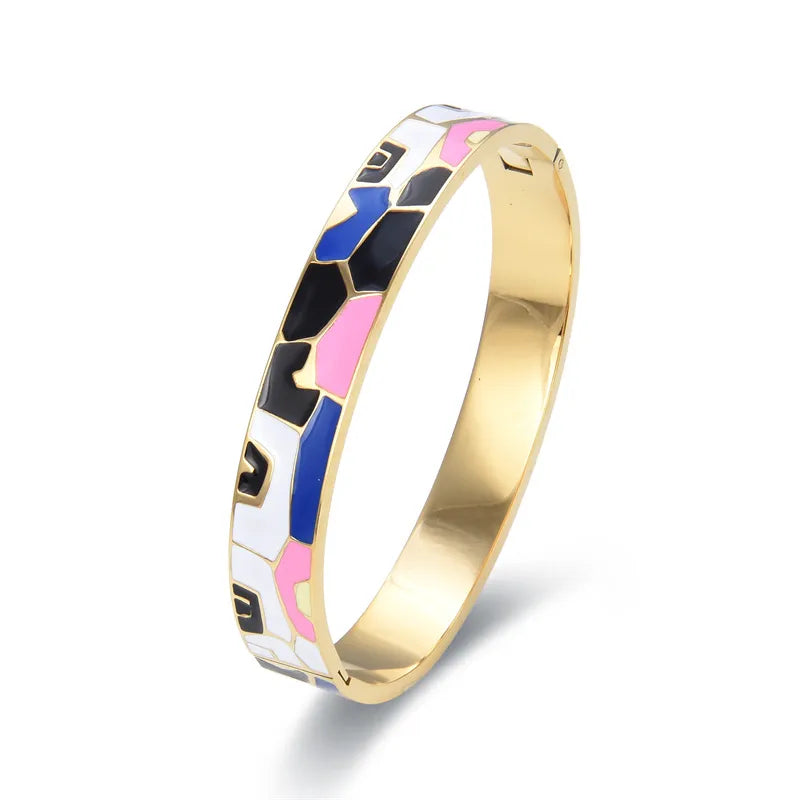Women's exquisite gold cuff bracelet, featuring a sparkling natural geode charm.