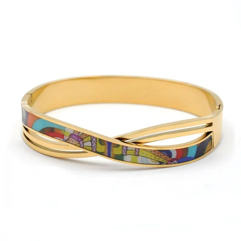 Dainty gold cuff bracelet for women, showcasing a captivating geode charm. Elegant fashion accessory.
