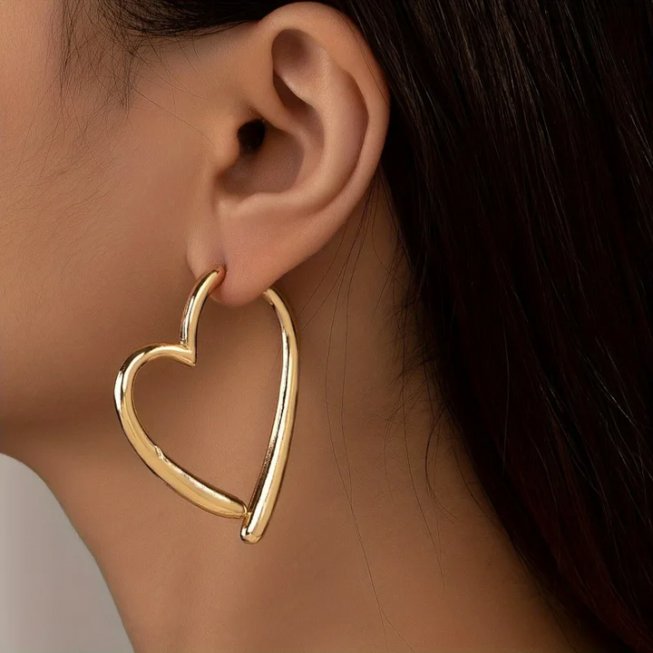 Elegant gold heart hoop earrings for women, a stylish non-tarnish jewelry accessory.