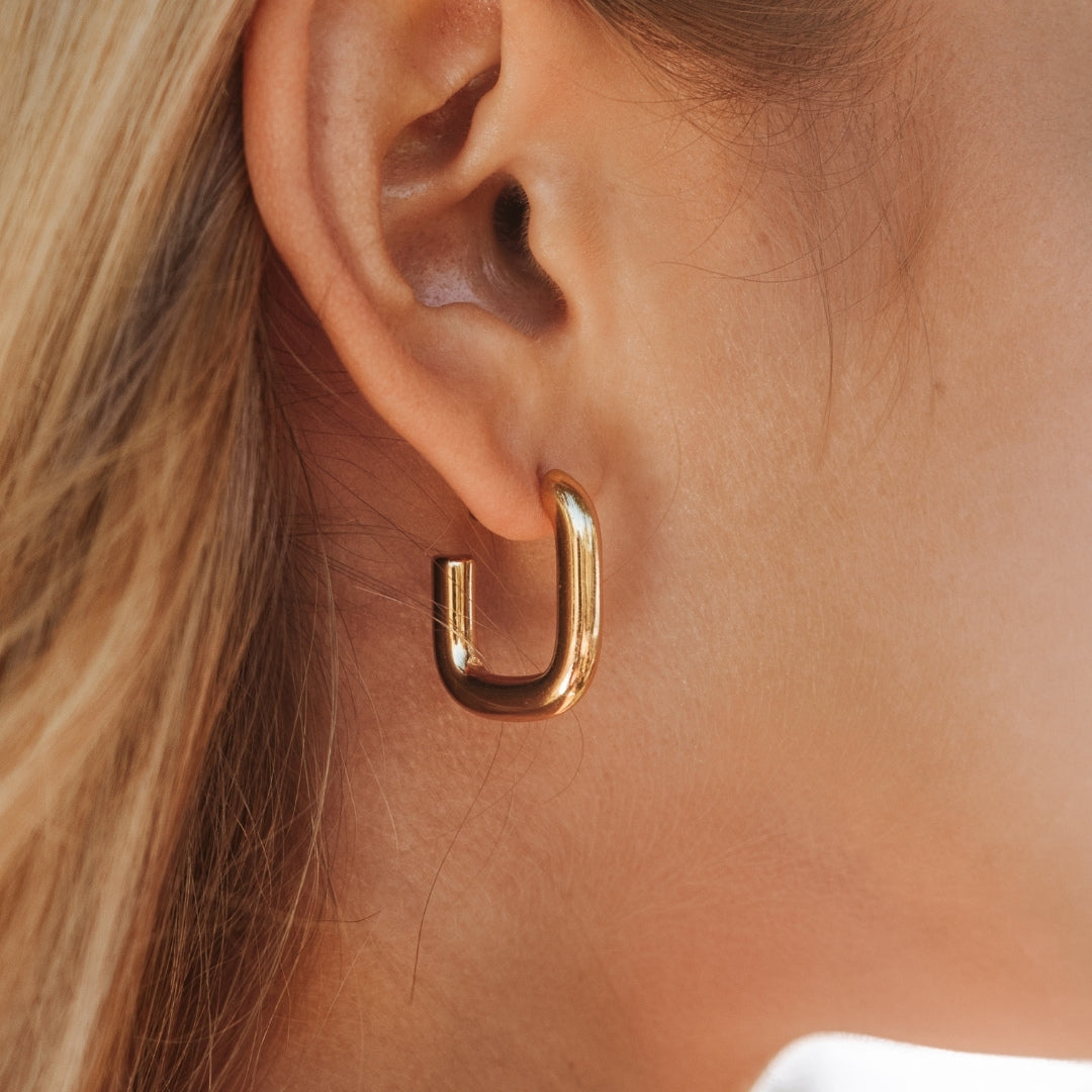 Elegant gold hoop earrings for women, a timeless fashion accessory perfect for any occasion.