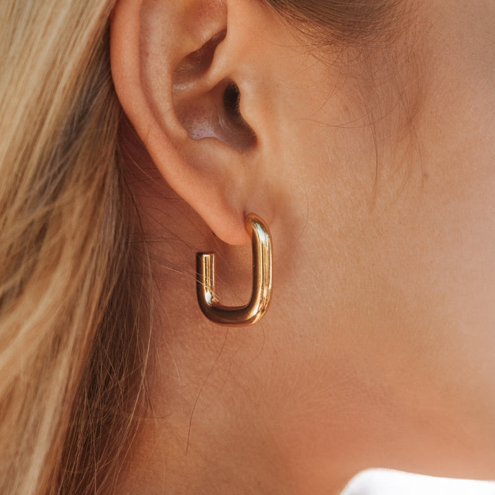 Elegant gold hoop earrings for women, a timeless fashion accessory perfect for any occasion.