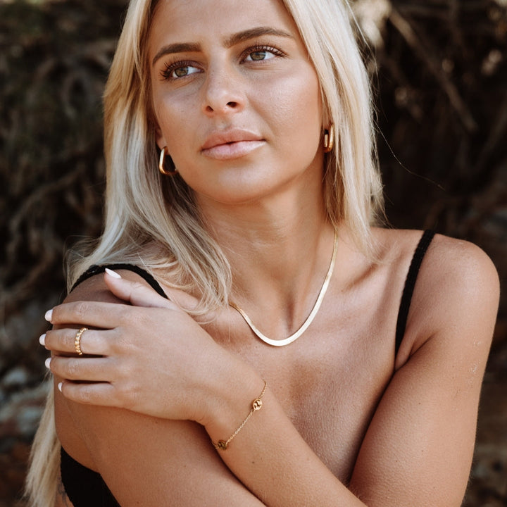 Classic women's hoop earrings, offering timeless elegance and a chic fashion statement.