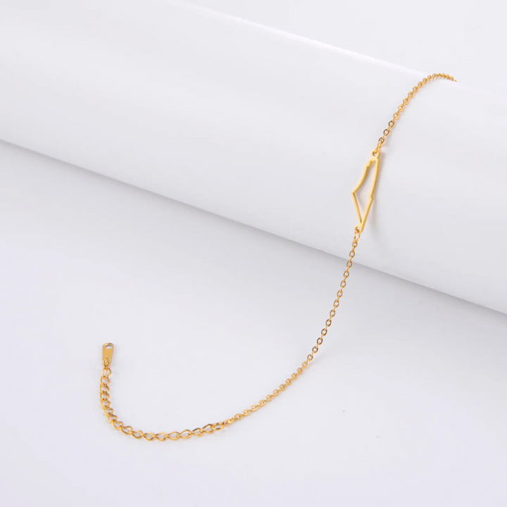 Close-up of a women's gold hope bracelet, adjustable & hypoallergenic