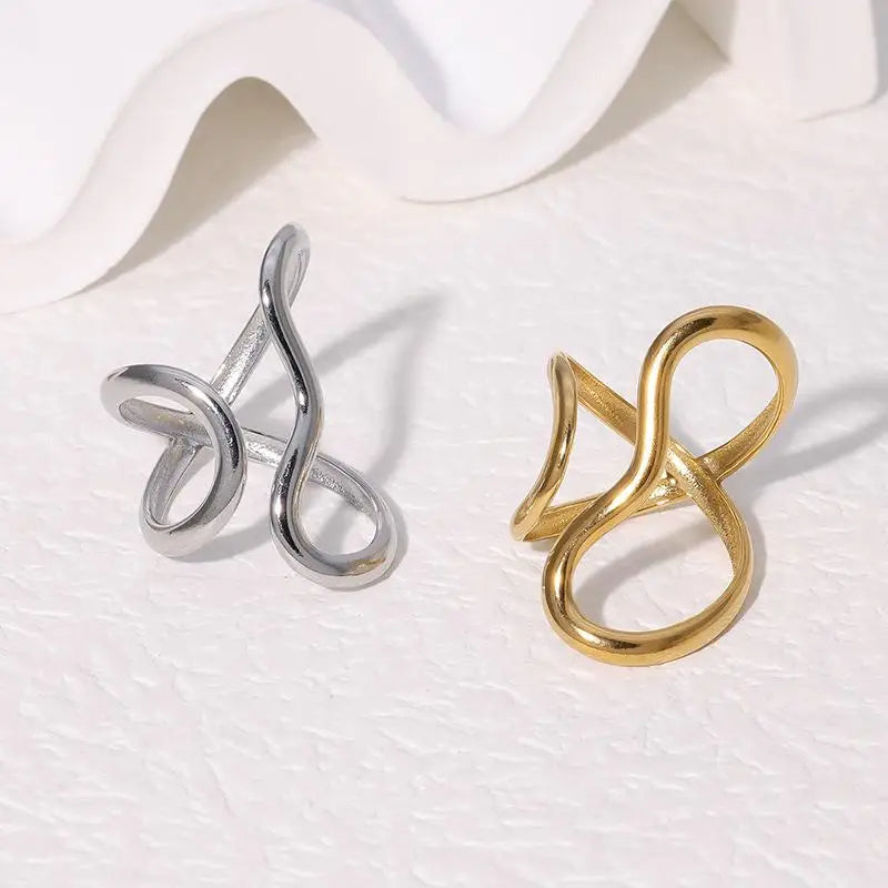 Adjustable silver infinity wrap ring, a minimalist and elegant piece of women's jewelry, also available in gold.