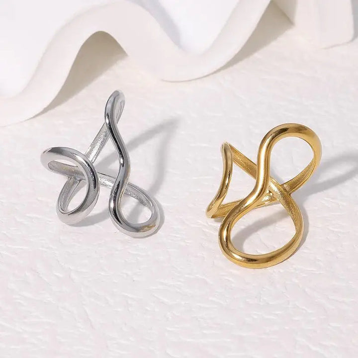Adjustable silver infinity wrap ring, a minimalist and elegant piece of women's jewelry, also available in gold.