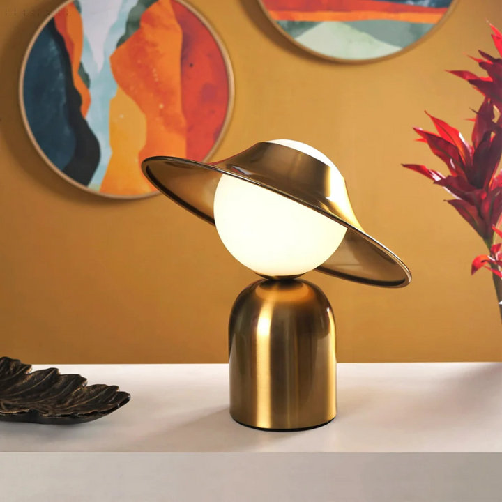 Elegant gold metal table lamp for modern home decor, a stylish accent for living room and bedroom lighting.