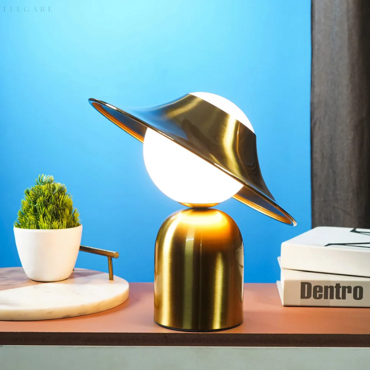 Modern gold metal table lamp providing warm home lighting, an elegant accent for any bedroom or living room.