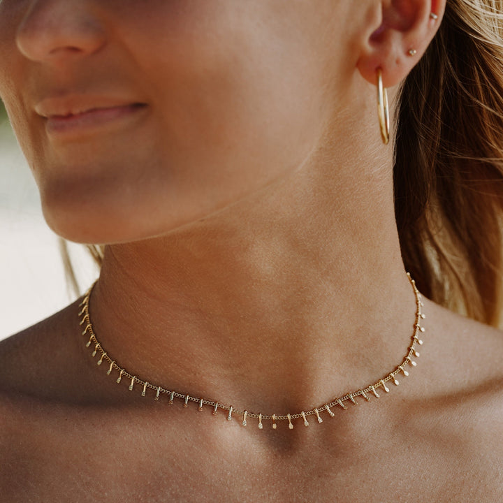 Chic silver minimalist choker necklace for women. Elegant adjustable jewelry, a subtle fashion statement.