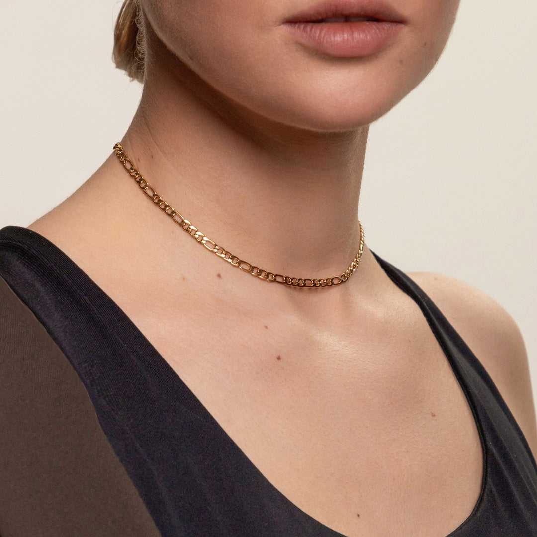Delicate gold choker necklace, a minimalist women's jewelry accessory, perfect for adding a touch of elegance.