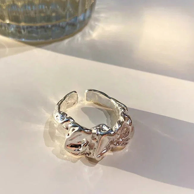 Elegant gold minimalist plissé lava ring for women. Unique stackable design, a perfect fashion accessory.