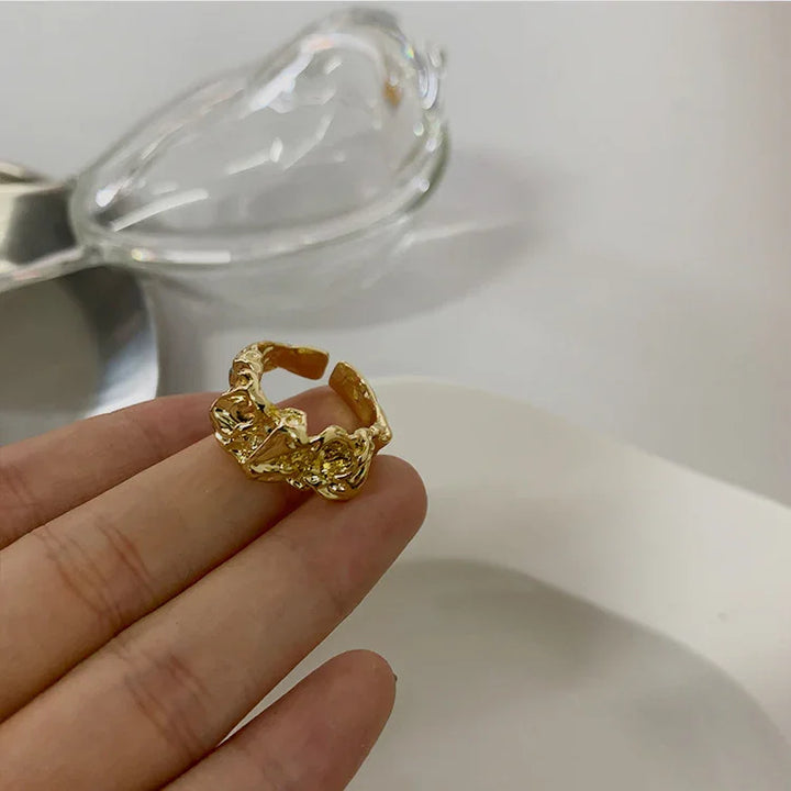 Women's minimalist plissé lava ring in gold or silver. Unique, elegant, and stackable fashion jewelry.
