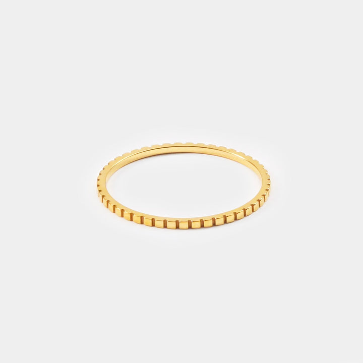 Elegant gold minimalist thin band ring for women. Delicate, stackable fashion accessory & women's jewelry.