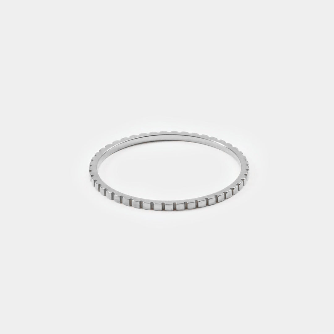 Simple gold thin band ring, versatile minimalist jewelry for women. Delicate, stackable fashion accessory.