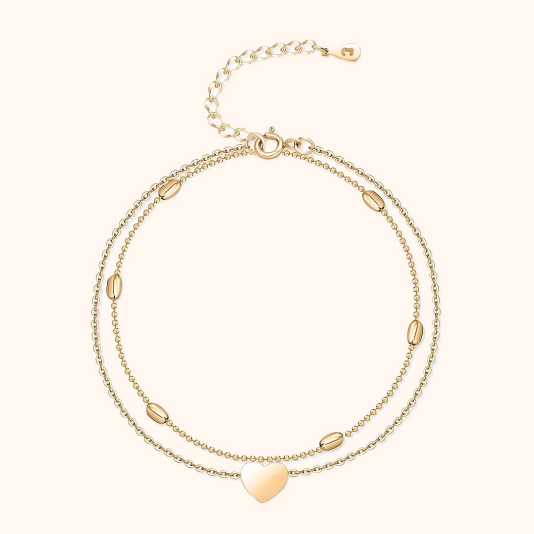 Elegant women's gold-plated heart charm double chain anklet. Stylish and romantic fashion jewelry.