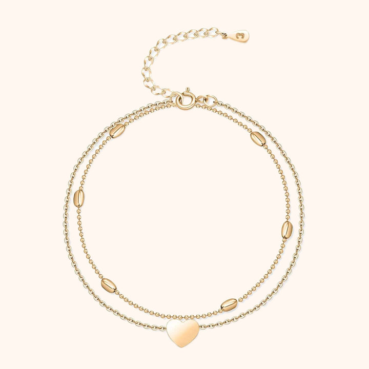 Elegant women's gold-plated heart charm double chain anklet. Stylish and romantic fashion jewelry.
