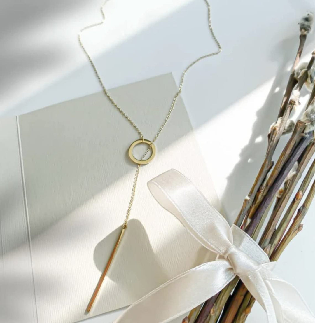 Gold plated lariat necklace, an elegant drop bar gift for women. Versatile and fashionable jewelry.
