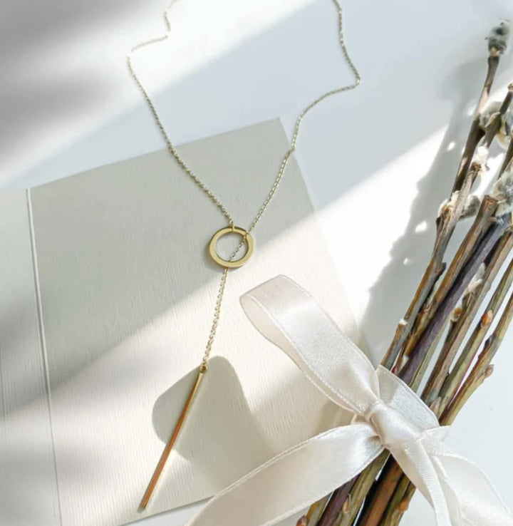 Gold plated lariat necklace, an elegant drop bar gift for women. Versatile and fashionable jewelry.