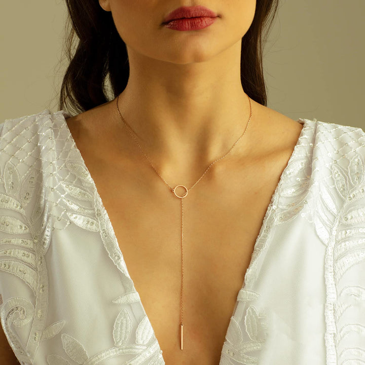 Women's elegant gold plated drop bar lariat necklace. Versatile fashion jewelry, perfect gift.