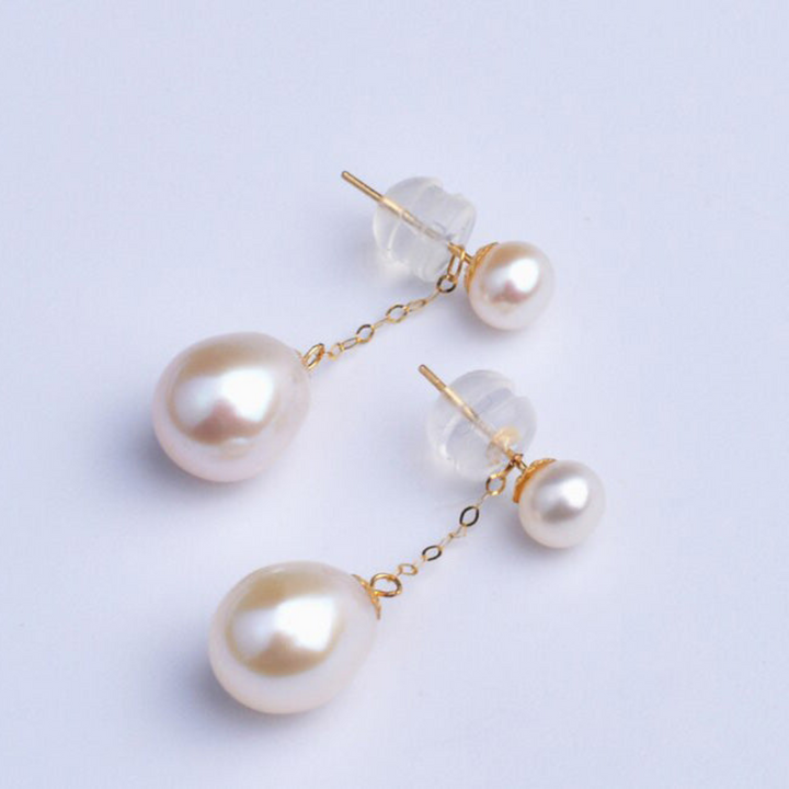 Exquisite gold-plated drop earrings with smooth, round pearls, an elegant addition to any woman's collection.