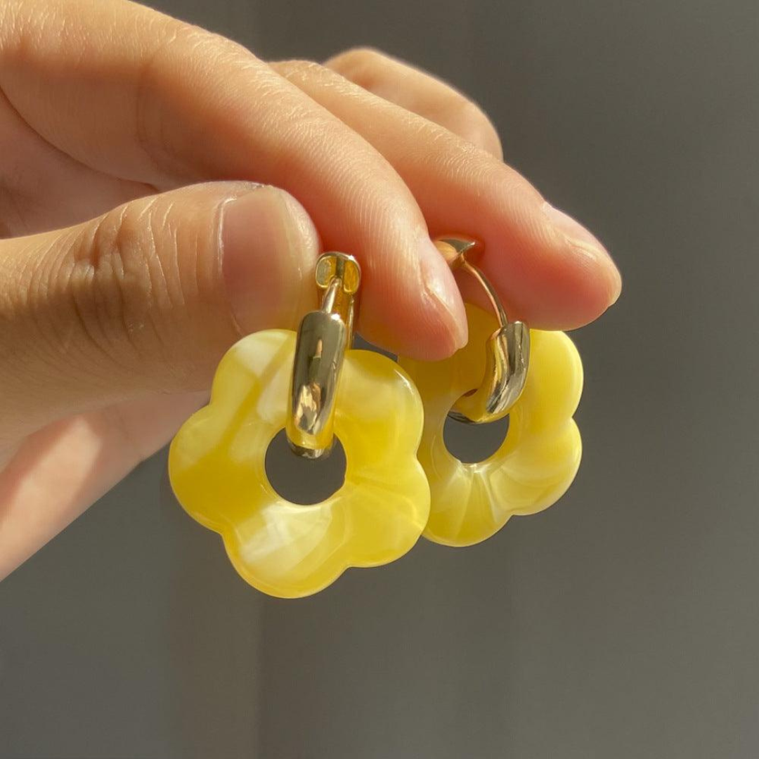 Chic gold plated flower earrings, versatile for both casual and formal occasions.