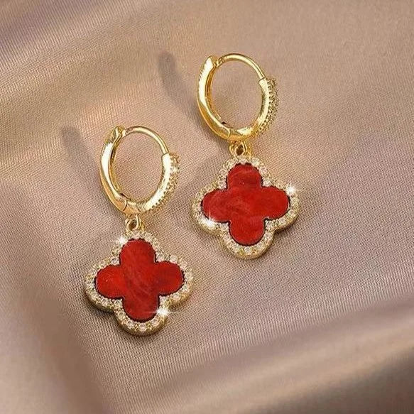 Elegant gold plated four leaf clover drop earrings for women, a lucky fashion accessory.