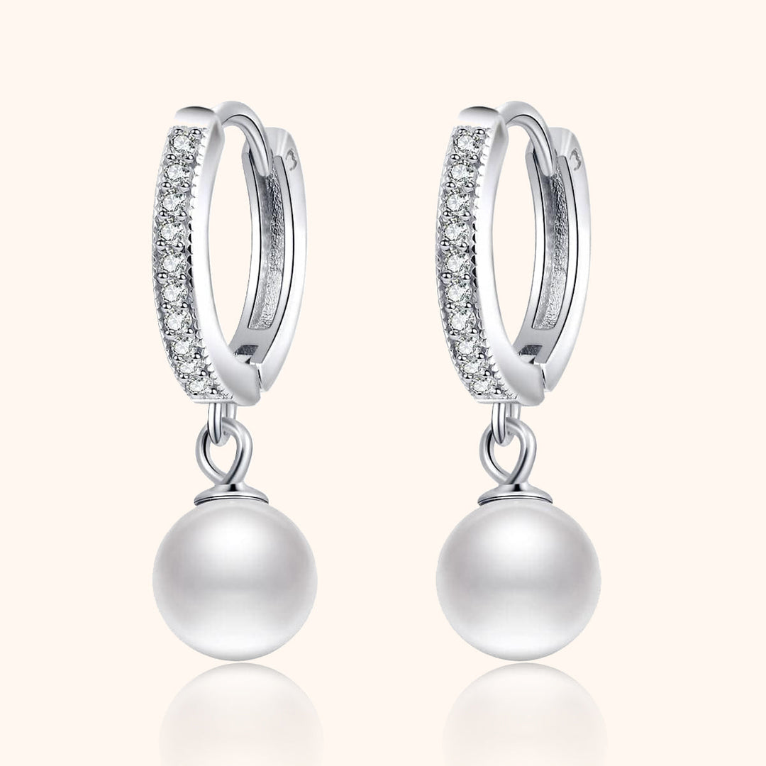 Elegant gold-plated hoop earrings with lustrous pearls and sparkling zirconia, perfect for women's jewelry collection.