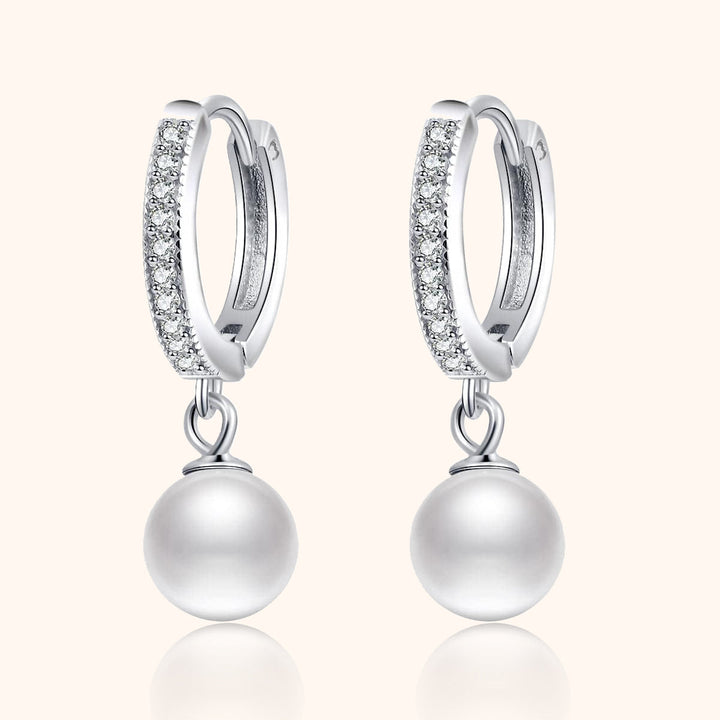 Elegant gold-plated hoop earrings with lustrous pearls and sparkling zirconia, perfect for women's jewelry collection.
