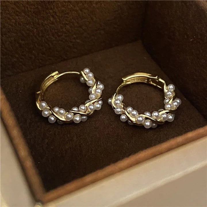 Delicate Isla pearl hoop earrings for women. Subtle gold-plated design, perfect versatile accessory for elegant style.