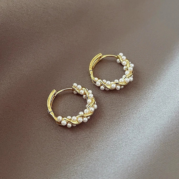 Versatile gold-plated hoop earrings with pearls. Elegant women's jewelry, delicate for everyday or special events.