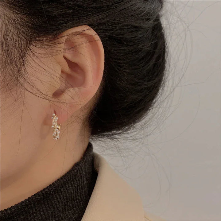 Subtle Isla design pearl earrings. Elegant women's gold-plated hoops, perfect timeless accessory for any style.