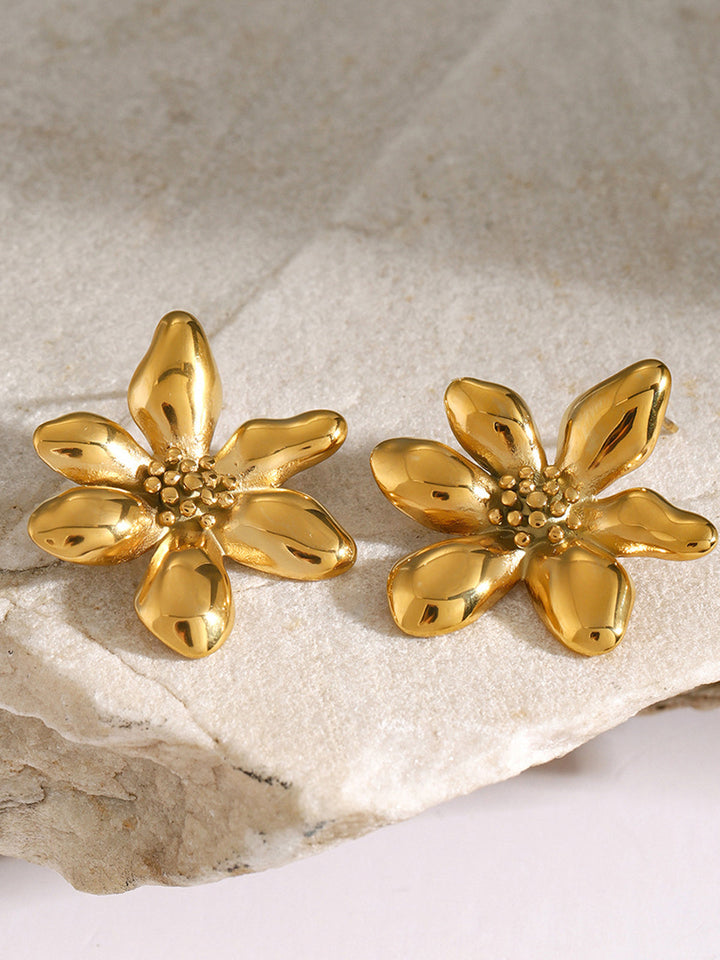 Women's statement drop earrings with an irregular flower design and gold plating.