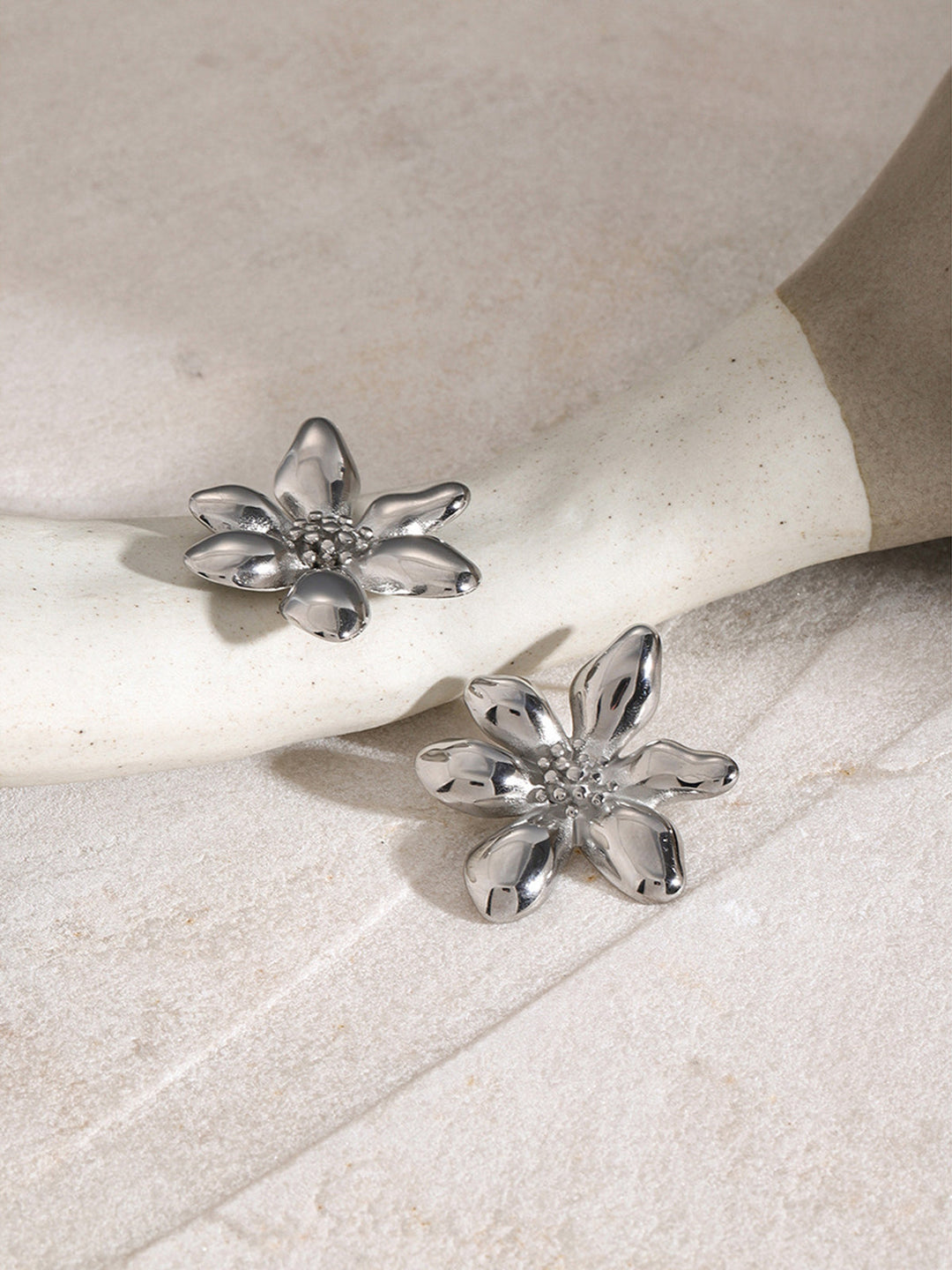 Delicate gold flower drop earrings for women, a chic and elegant jewelry piece.