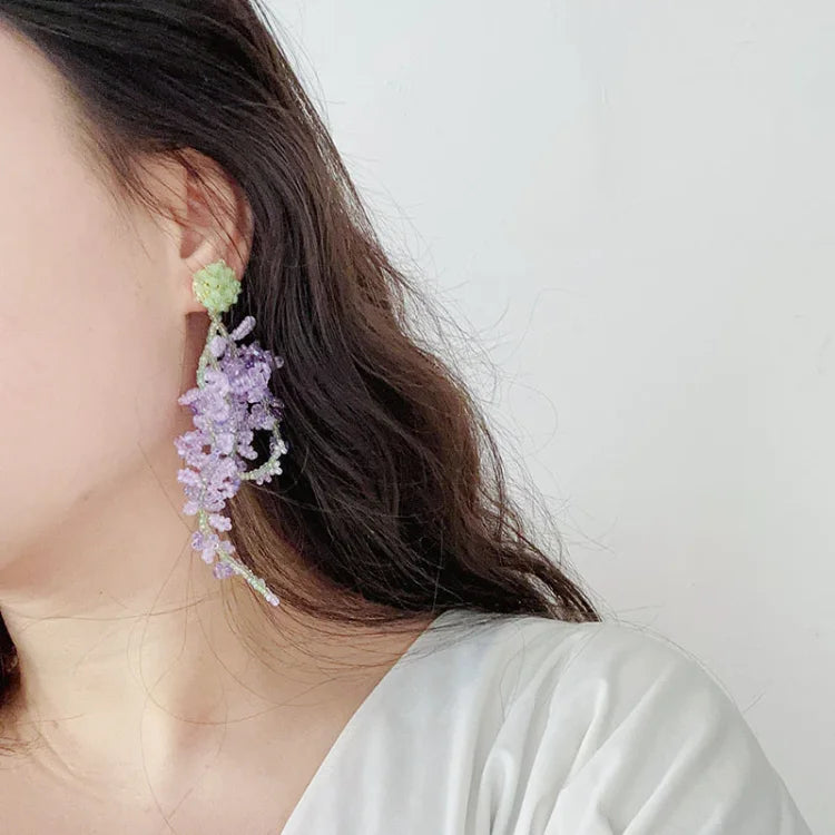 Women's artistic wisteria cluster earrings, gold-plated and elegantly designed with a captivating forest theme.