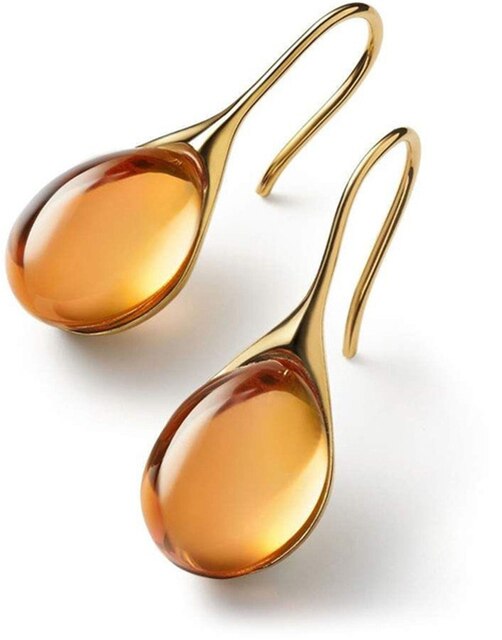 Sparkling crystal drop earrings for women. Elegant gold-plated dangle earrings, fashion jewelry enhancing any outfit.